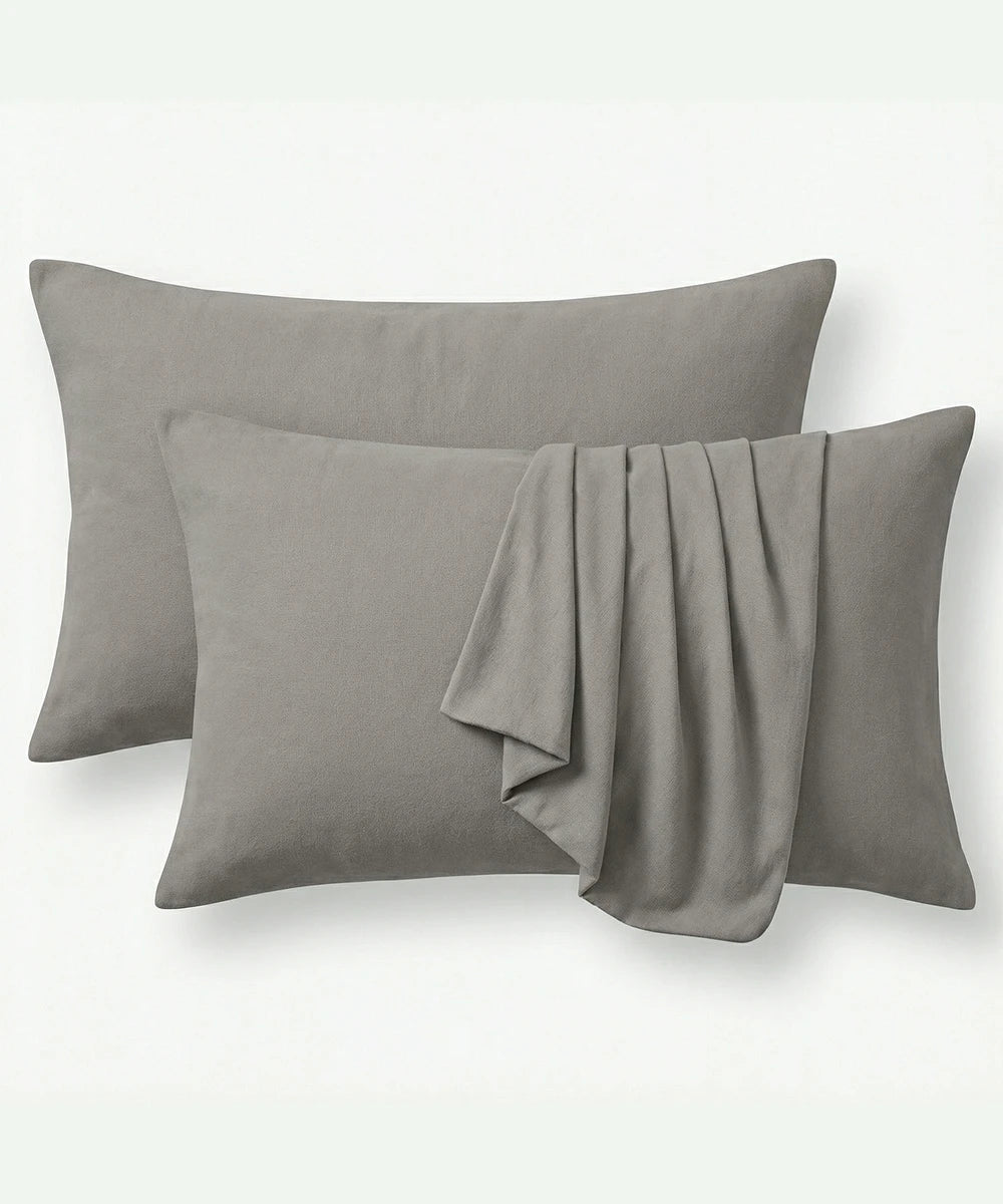 Two Moon mist pillows and pillowcases with a folded on a white background. 