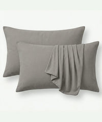 Two Moon mist pillows and pillowcases with a folded on a white background. 
