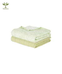 Folded green duo towels on a white background.