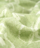 Close-up of light green fabric texture