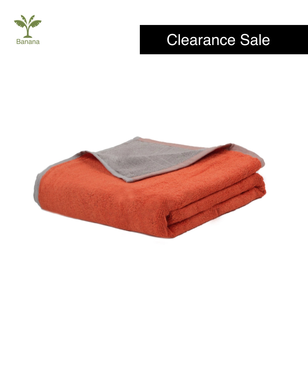 Orange blanket with gray lining on a white background, featuring 'Banana' brand logo and 'Clearance Sale' text.
