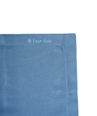 Close-up of a blue fabric of pillowcase with 'Face Side' text on a white background