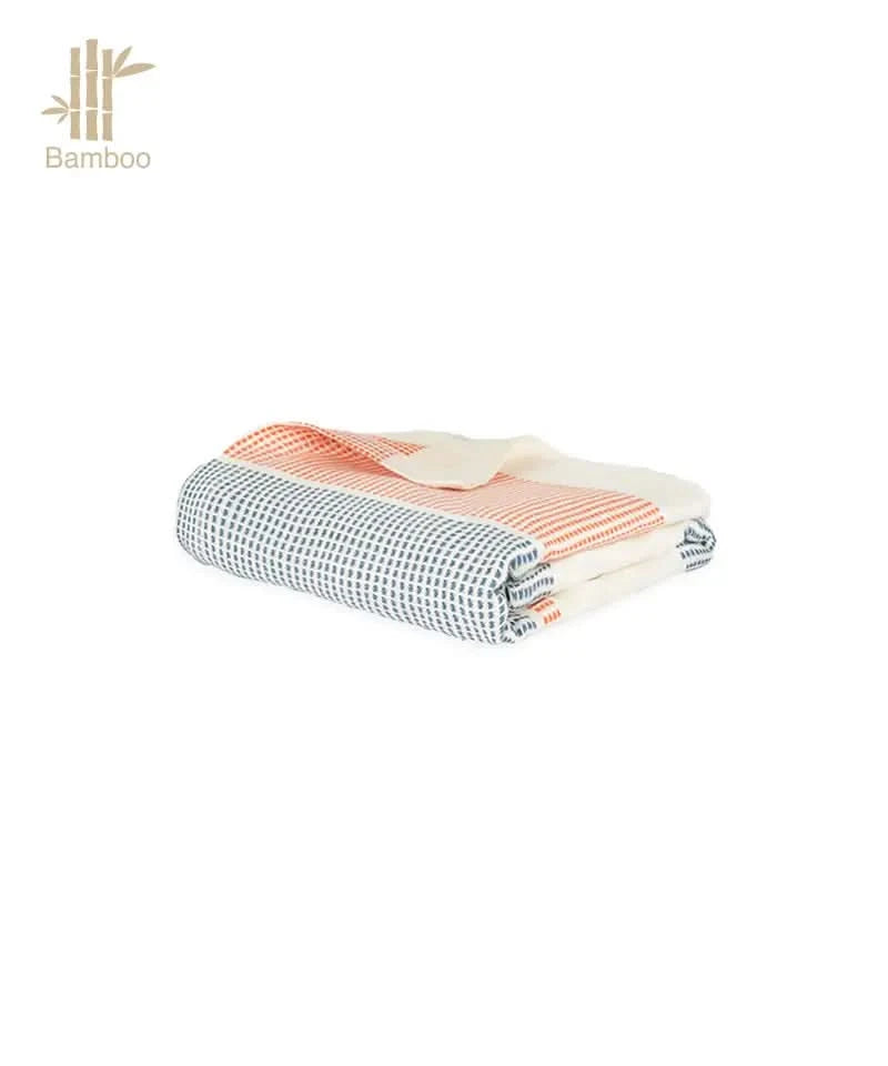 Folded bamboo dobby towel with a checkered pattern on a white background.