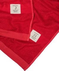 Red towel with 'Face Zone' label on a white background