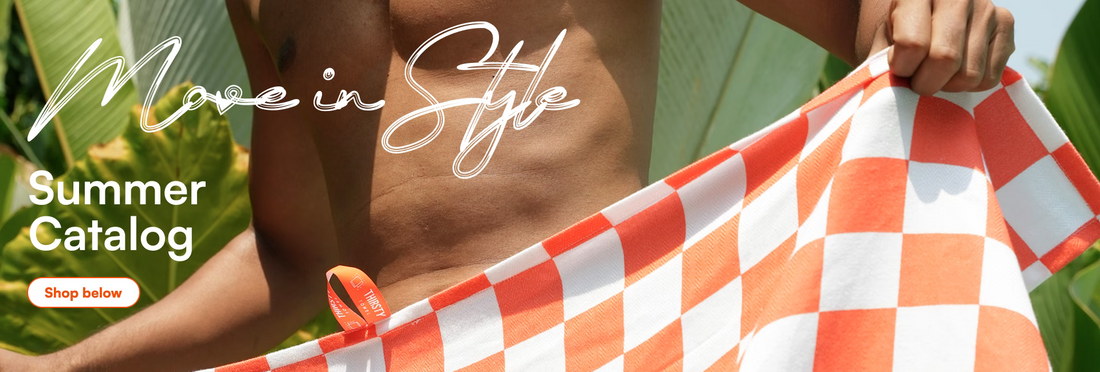 Person holding a red and white checkered towel with 'Move in Style' text and summer catalog promotion.