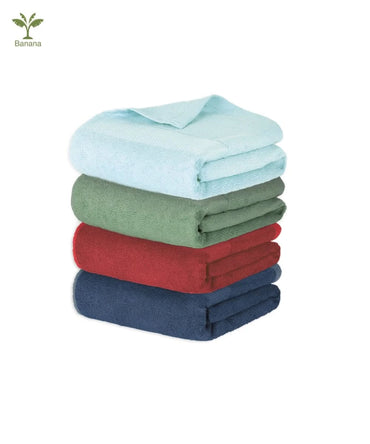 Stack of folded towels in blue, green, red, and navy on a white background with Banana icon.