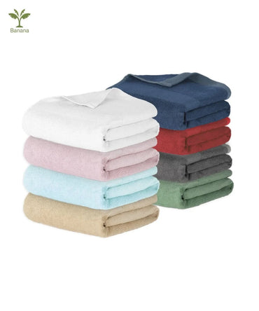Stack of folded towels in various colors on a white background