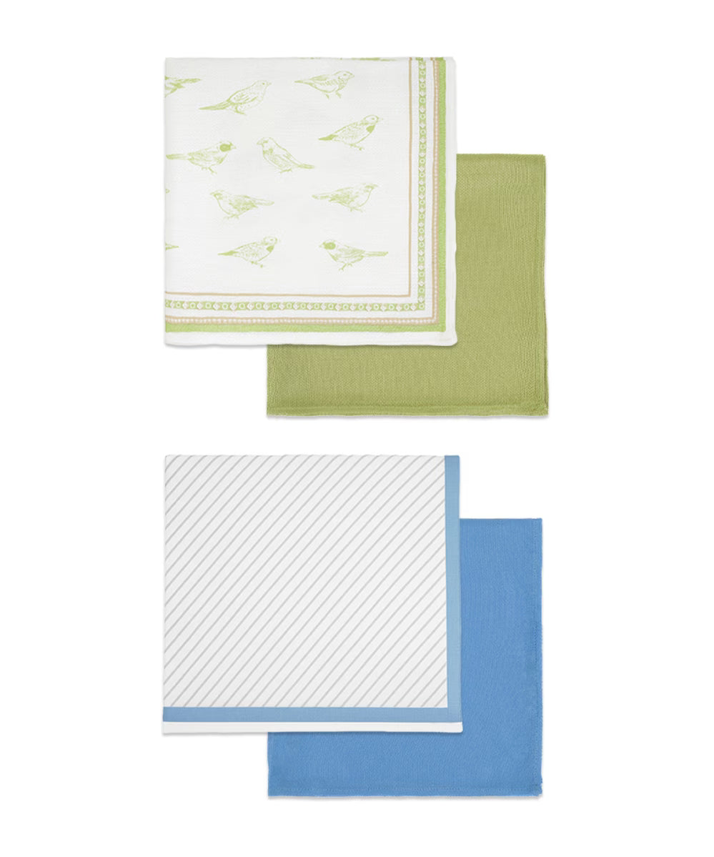 Set of four kitchen towels with different patterns on a white background