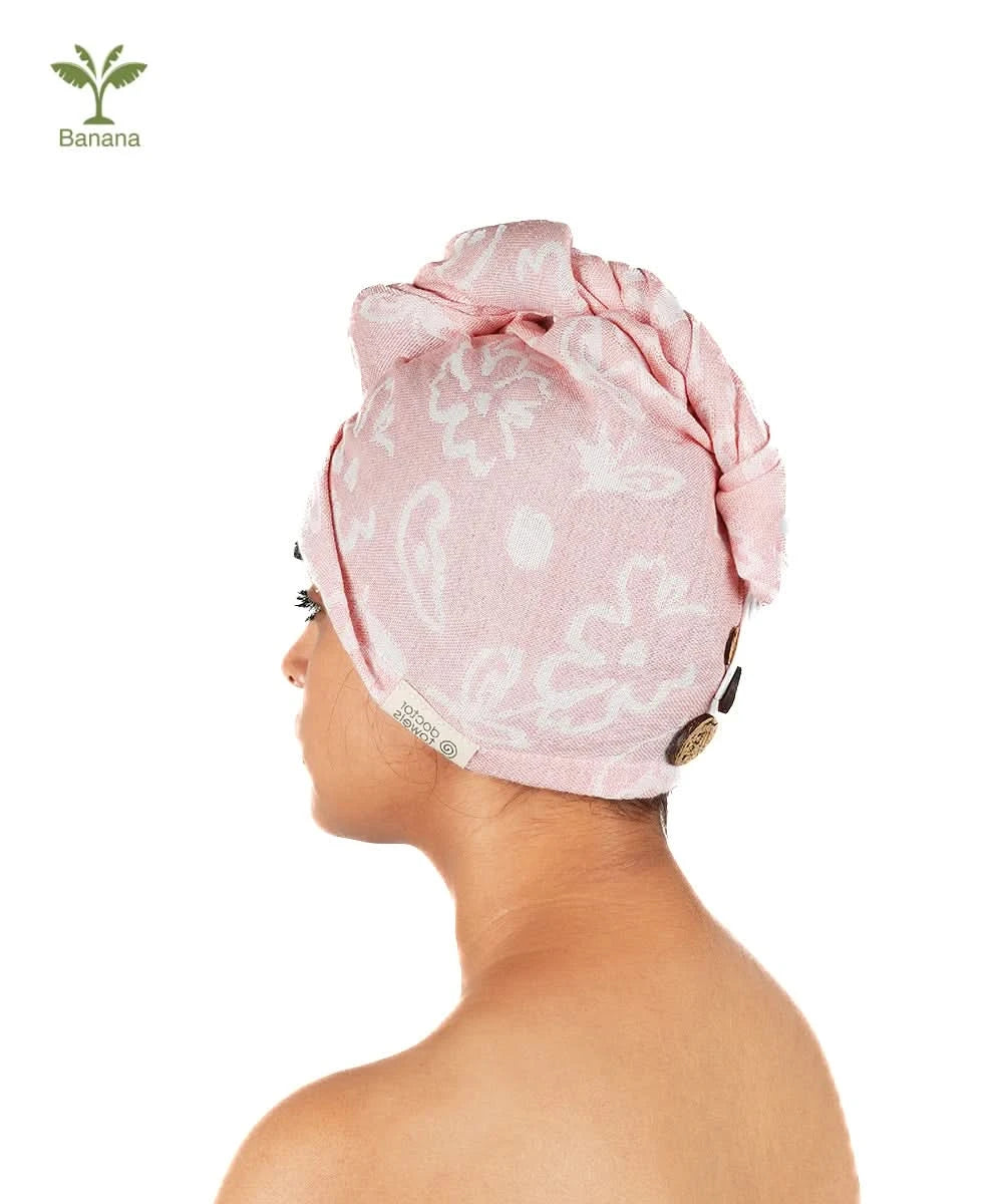 Woman wearing a Banana floral hair towel on a white background