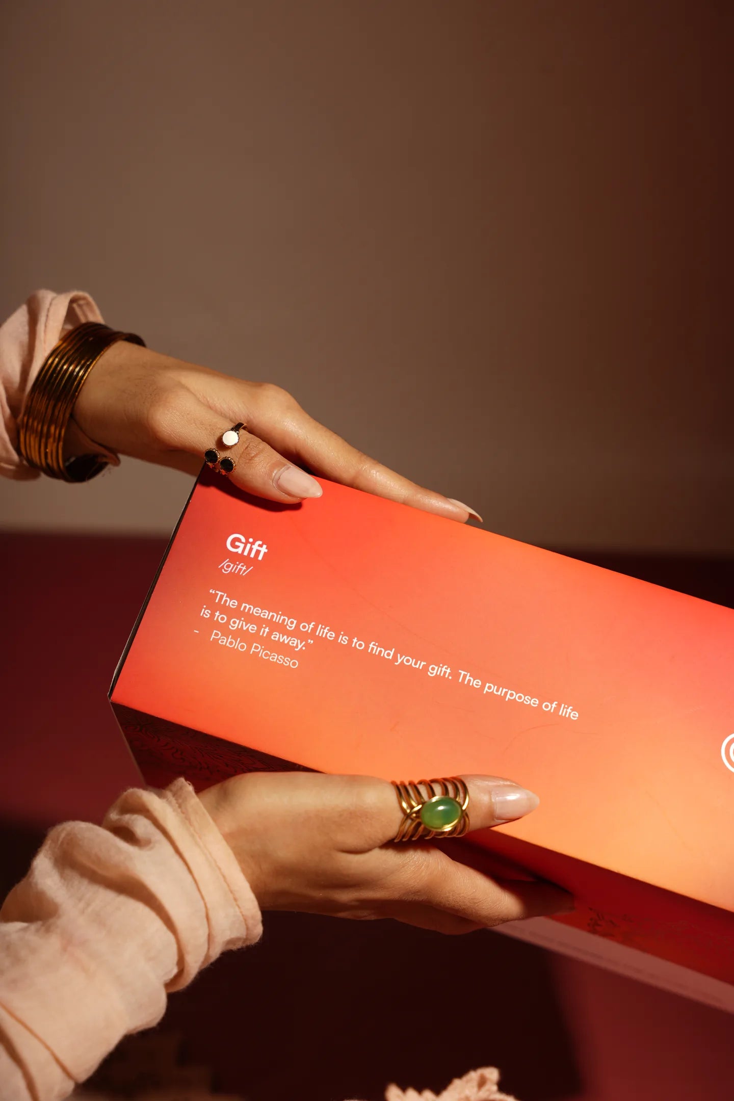 Close-up of hands holding a festive gift box