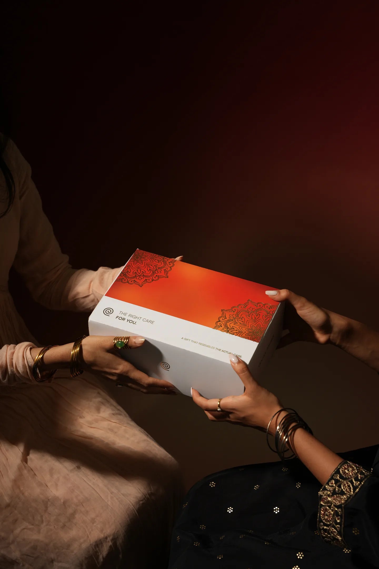 Festive gift box being handed to someone